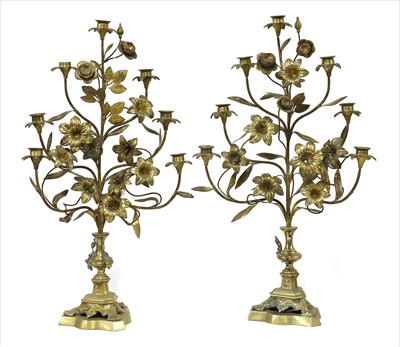 Lot 763 - A pair of Continental floral gilt metal candlestick stands