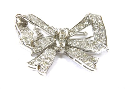 Lot 330 - A diamond set bow brooch