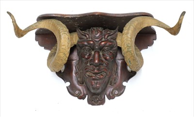 Lot 39 - AN ANTIQUE DEVIL WALL BRACKET