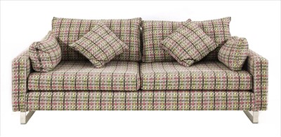 Lot 525 - A contemporary upholstered three-seater settee
