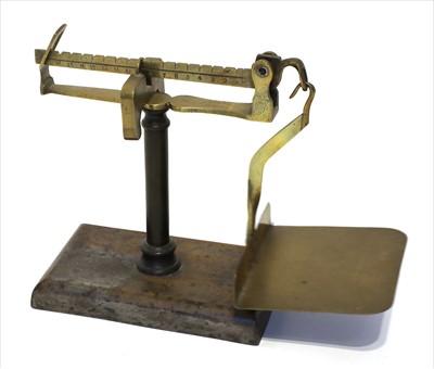 Lot 1115 - A brass and steel steelyard postal scale