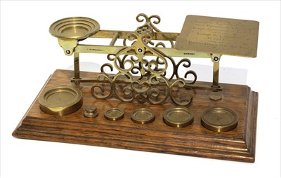 Lot 1118 - A set of brass postal scales