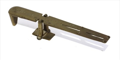 Lot 1148 - A brass sovereign rocker