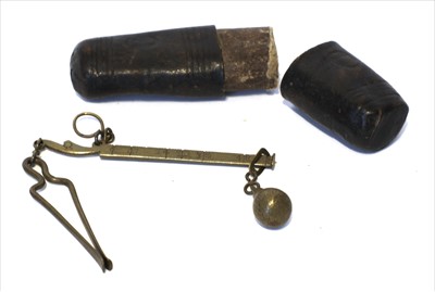 Lot 1164 - A brass coin steelyard