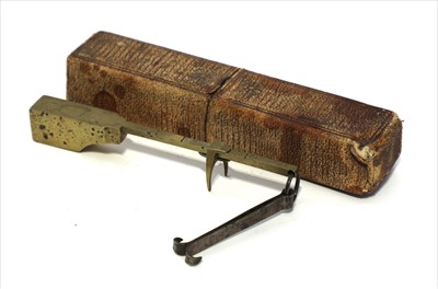 Lot 1168 - A brass shelf edge bismar