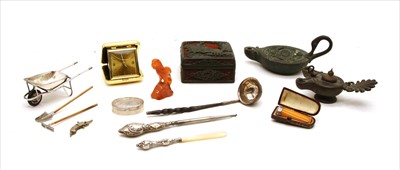 Lot 40 - A miniature silver plated wheelbarrow, rake and spade