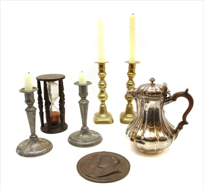 Lot 190 - A pair of George III style brass ejector candlesticks