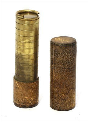 Lot 1180 - A leather and brass sprung sovereign case