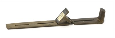 Lot 1186 - A brass unequal arm rocker