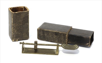 Lot 1189 - A brass sovereign rocker