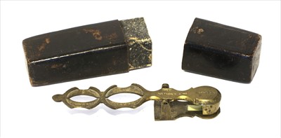 Lot 1246 - A brass sovereign rocker