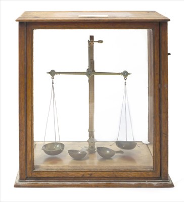 Lot 1029 - A walnut and glass cased jeweller's beamscale