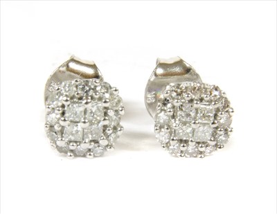 Lot 82 - A pair of white gold diamond cluster stud earrings
