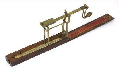 Lot 1031 - A brass single arm folder