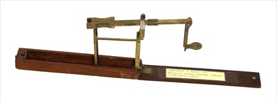 Lot 1035 - A single arm brass folder