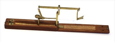 Lot 1041 - A mahogany cased equal arm brass folding coin scale