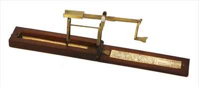 Lot 1046 - A walnut cased brass folding sovereign balance