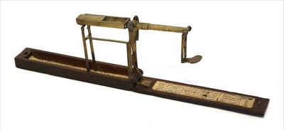 Lot 1049 - A mahogany cased folding brass coin scale