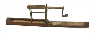Lot 1050 - A mahogany cased folding brass coin scale