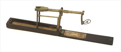 Lot 1068 - A rosewood cased brass folding coin scale