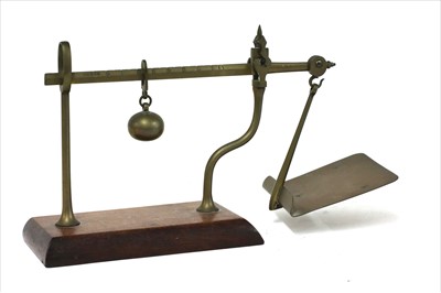 Lot 1103 - A brass steelyard postal scale