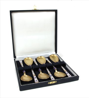 Lot 212 - A cased set of Danish gilt silver and enamel teaspoons