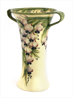 Lot 54 - A William Moorcroft Macintyre twin-handled 'Wisteria' vase