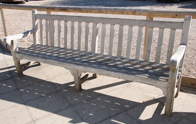 Lot 112 - A slatted teak garden seat