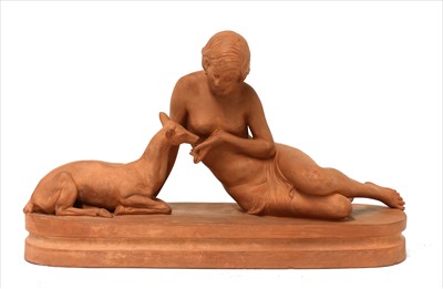 Lot 351 - An Art Deco terracotta figure of a nude feeding a deer