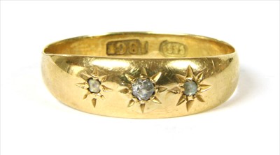 Lot 6 - A gold three stone diamond ring