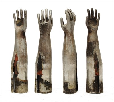 Lot 370 - FOUR METAL GLOVE MOULDS