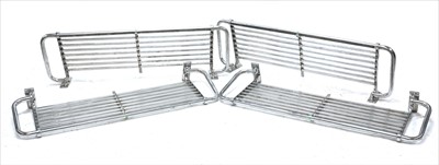 Lot 319 - Four chrome metal luggage racks