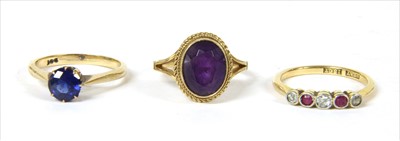 Lot 23 - A gold diamond and ruby five stone ring