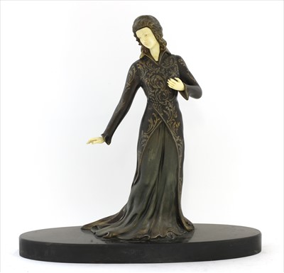 Lot 151 - An Art Deco patinated spelter figure of a lady