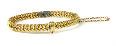 Lot 42 - A gold oval hinged bangle