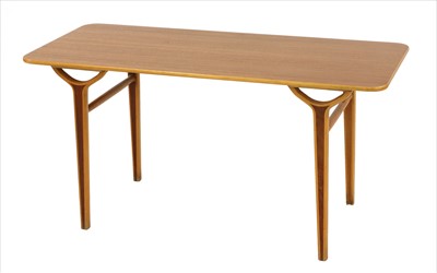 Lot 545 - A teak and beech coffee table
