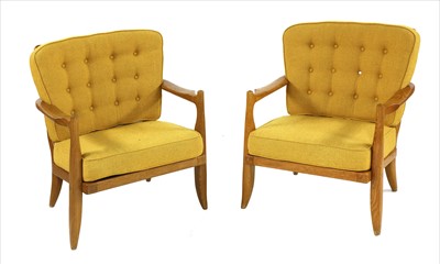 Lot 306 - A pair of French oak lounge chairs