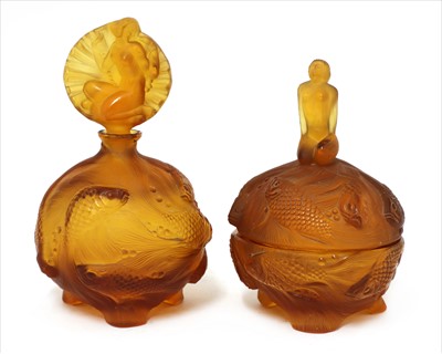 Lot 122 - An Art Deco moulded amber glass dressing table set