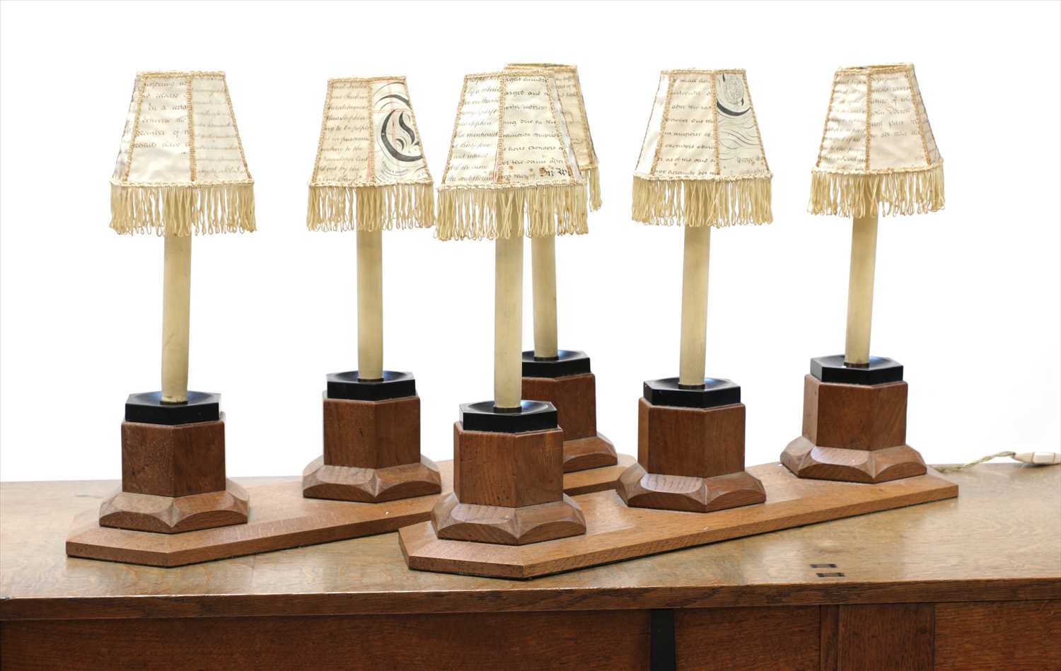 Lot 242 - A pair of oak three-light table lamps