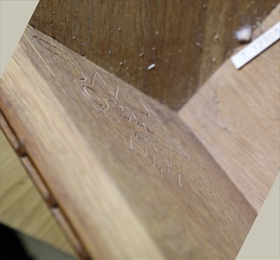 Lot 232 - An oak hanging corner cupboard
