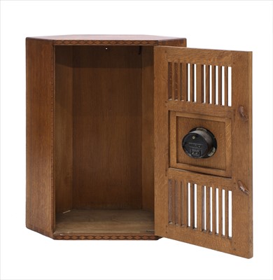 Lot 232 - An oak hanging corner cupboard