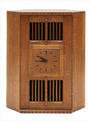 Lot 232 - An oak hanging corner cupboard