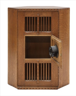 Lot 232 - An oak hanging corner cupboard