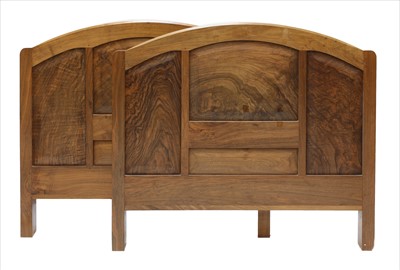 Lot 258 - A walnut headboard and footboard