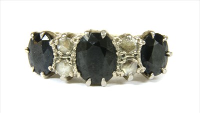 Lot 25 - An 18ct gold sapphire and diamond ring