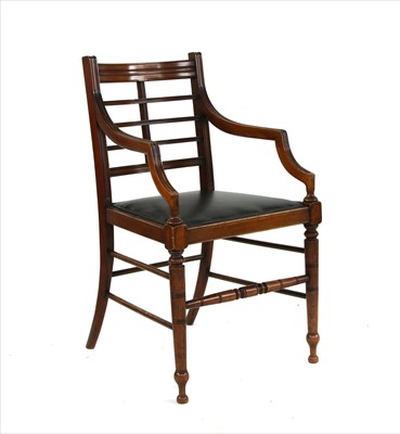 Lot 38 - A walnut elbow chair