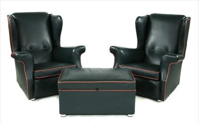 Lot 589 - A pair of green leather club armchairs