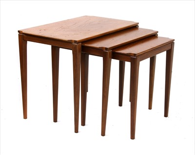 Lot 539 - A nest of three teak tables