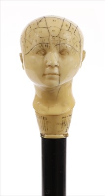 Lot 175 - A carved ivory phrenological head walking stick