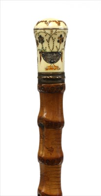 Lot 168 - An ivory and piqué walking stick